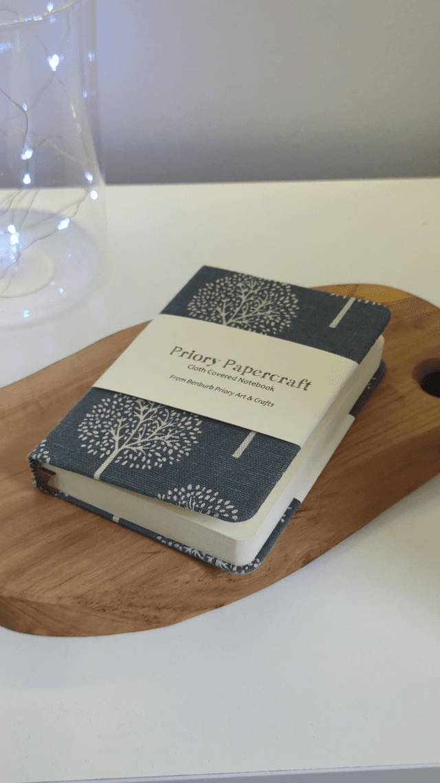 Cloth covered notebook. A6 size with smooth cream paper